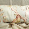 Lumber Cushion in Peach Bird in Tree Design